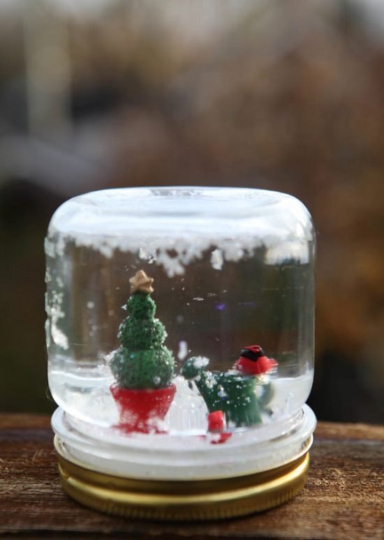 These Miniature Christmas Fairy Garden Ideas are perfect for tabletop decorations or keep them near your Christmas tree. 