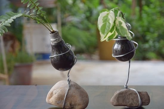Create this brilliant DIY Bulb Planter to display in any of your room. It gives an industrial touch to your interior!