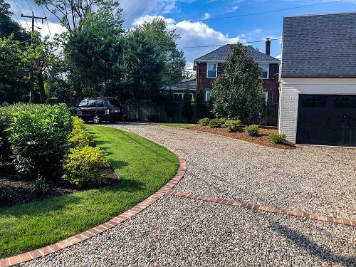 Gravel Driveway and Brick-lined Garden Beds
