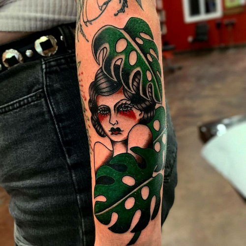 Woman with Monstera Leaf Cloak tattoo