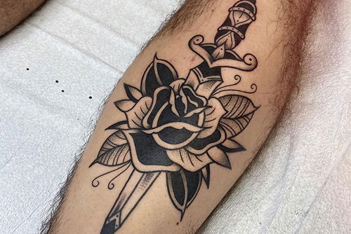Sword Piercing a Rose tattoo