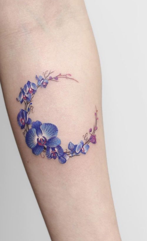 Orchid Flowers Forming a Crescent Moon tattoo