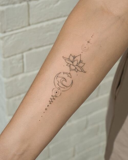 Small Lotus, Shark with Waves, and Geometrical Designs tattoo