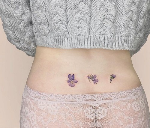 Pale Violets on the Lower Back February Birth Flower Tattoo 7