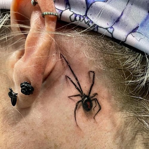 Tiny Spider Black Widow Behind the Ear tattoo