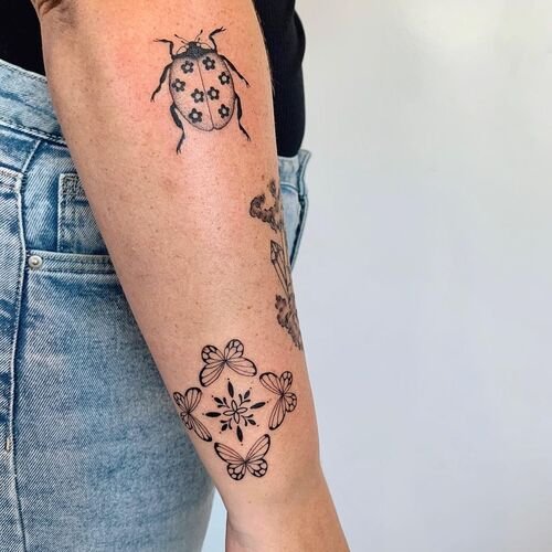 Ladybug with Flowers on its Body tattoo ideas