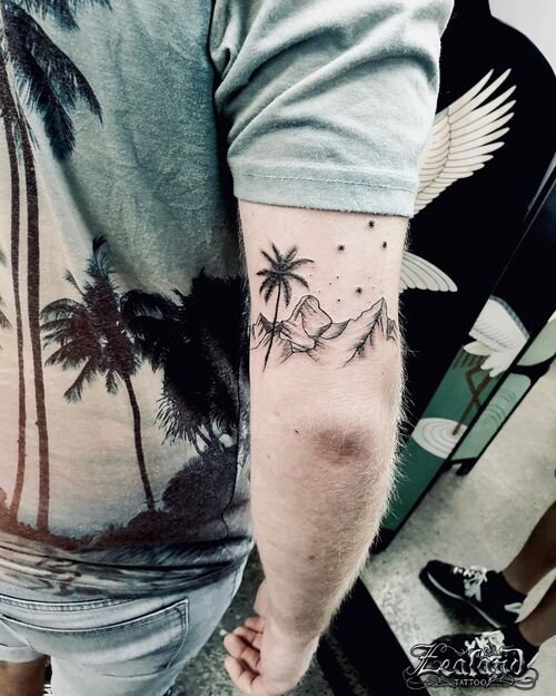 best Small Tattoo of Palm Trees, Mountains, and Stars
