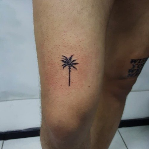 Tiny Palm Tree on the Thigh tattoo