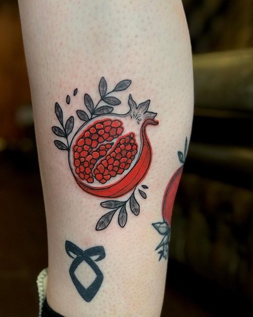 Cut Pomegranate with Leaves tattoo