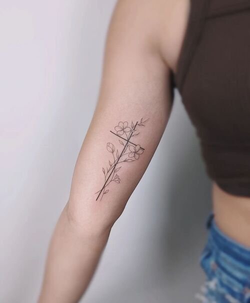 Simple Line Art Cross with Flowers Tattoo 9