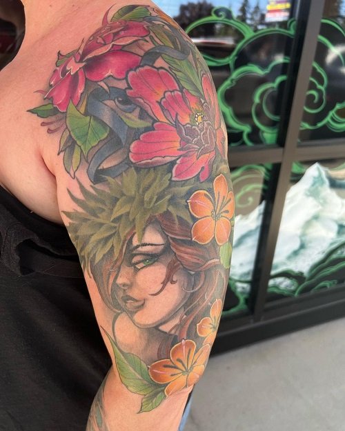 Hawaiian Flowers on Shoulder and Arm tattoo