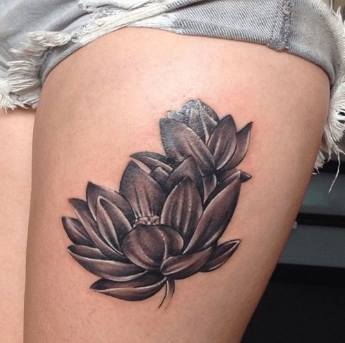 Black lotus tattoo on thigh