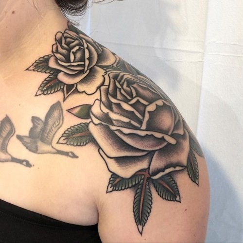 Freehand Black Roses fowers tattoo ideas