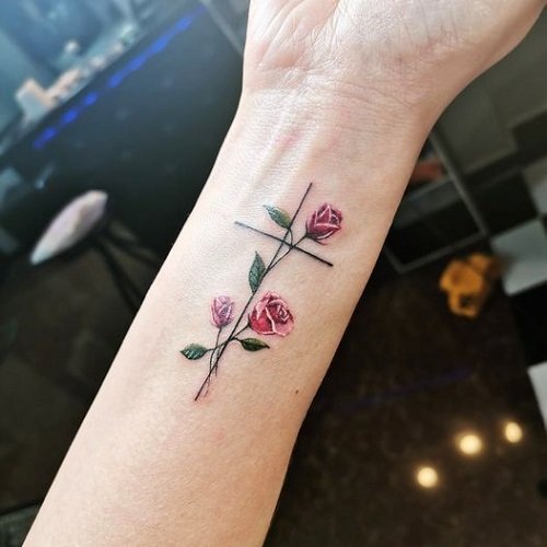 feminine cross with flowers tattoo 5