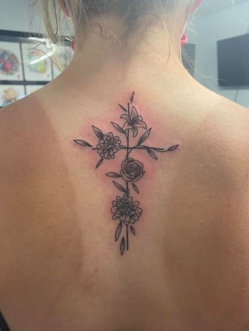cross and flowers female tattoo 6