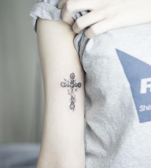 cross and flowers female tattoo 4