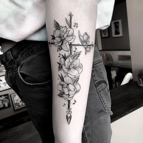 cross and flowers female tattoo 2
