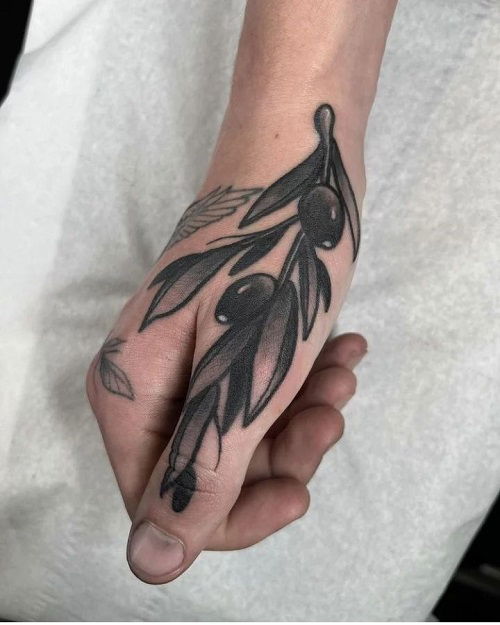 thumb olive branch tattoo